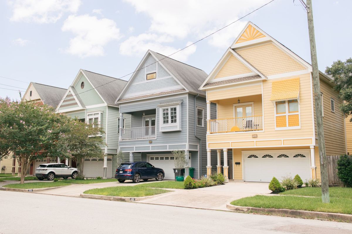 Row of newly built two-storey houses with garages on a quiet Texas street