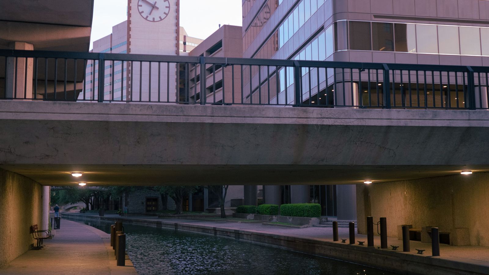 Walkway and canal passing beneath a bridge on the San Antonio River